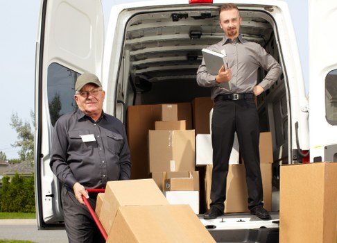 Man with van moving boxes and furniture for a booking process overview