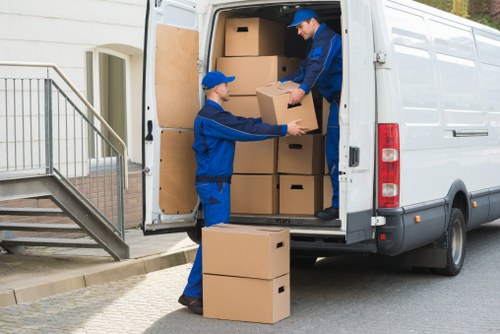 Office furniture and equipment being handled during a Muswell Hill move