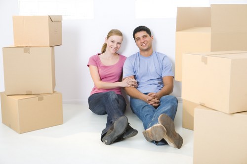 Professional movers loading items carefully into a van