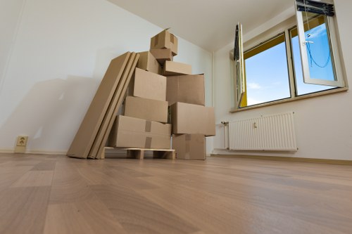 Staff member handling furniture with care during local removals