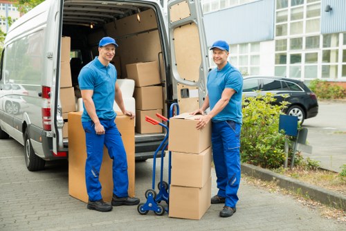 Packed moving boxes and furniture ready for transport